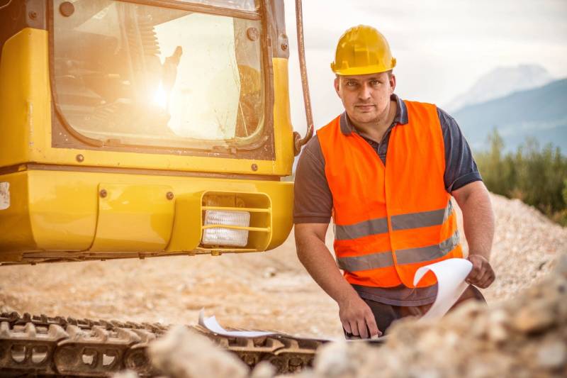 worker checking blueprints